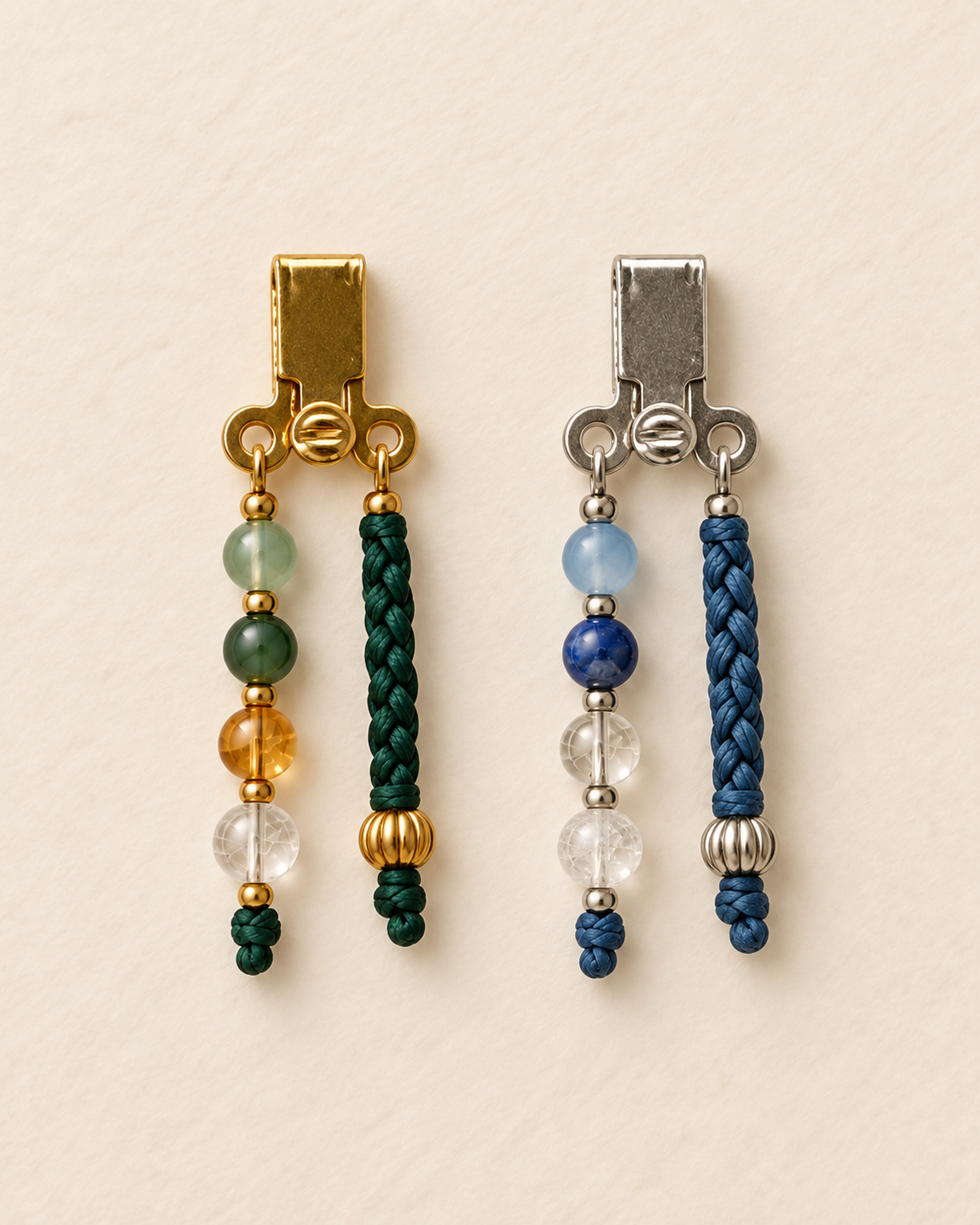 Detached gold and silver intention modules, each with a crystal tail and a short braided tail